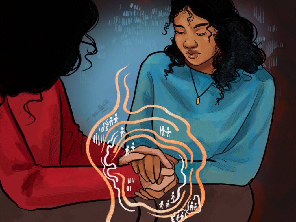 Two people sit together, one holding the others hand in comfort. Abstract glowing lines and small figures surround their hands, symbolising support and connection. The mood is caring and empathetic.